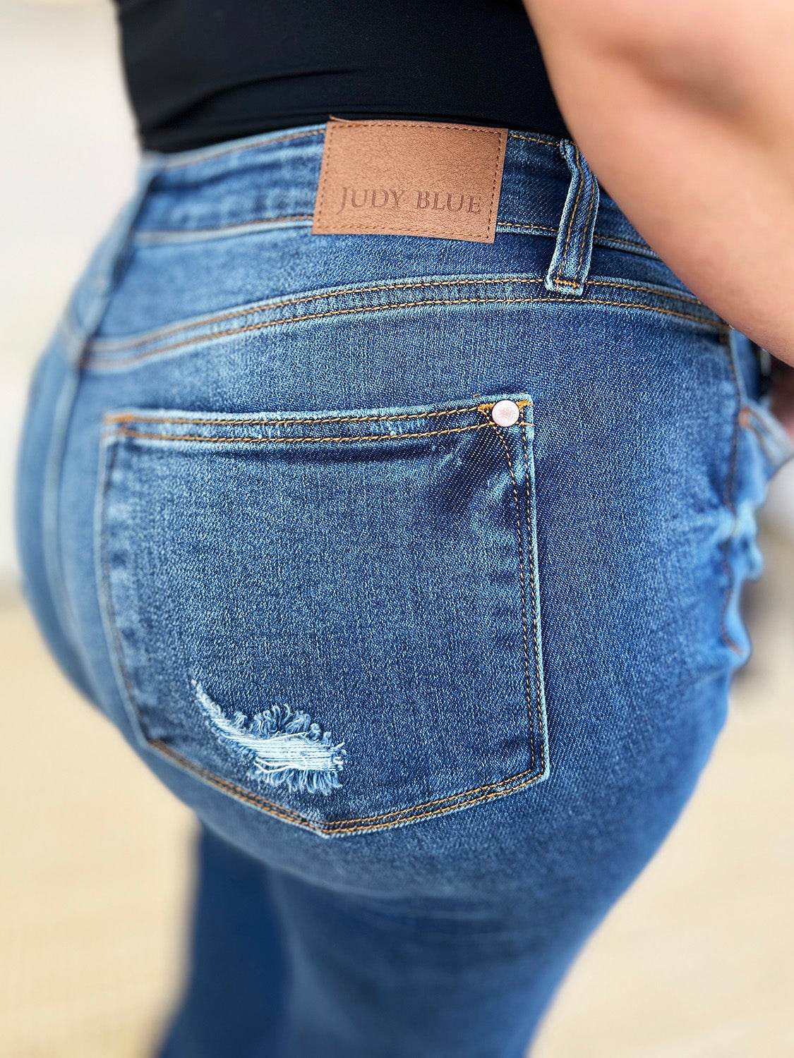 Judy Blue Full Size Mid Rise Distressed Raw Hem Jeans - DaTrendStore.Com