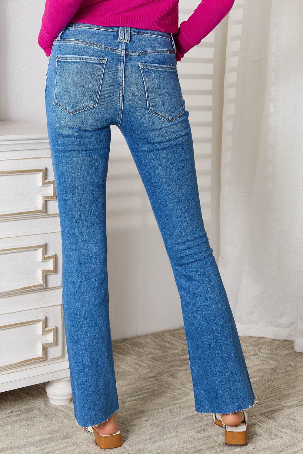 Kancan Full Size Distressed Raw Hem Bootcut Jeans - DaTrendStore.Com